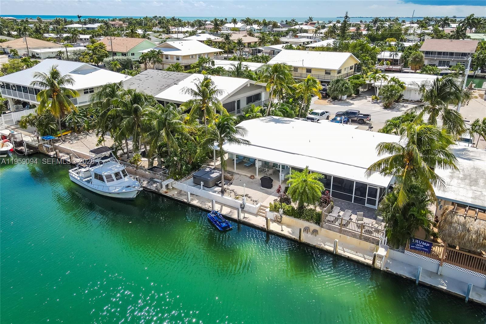 410 10th Street Key Colony Beach, FL 33051 - Photo 1 of 62 an aerial view of residential houses with outdoor space and lake view