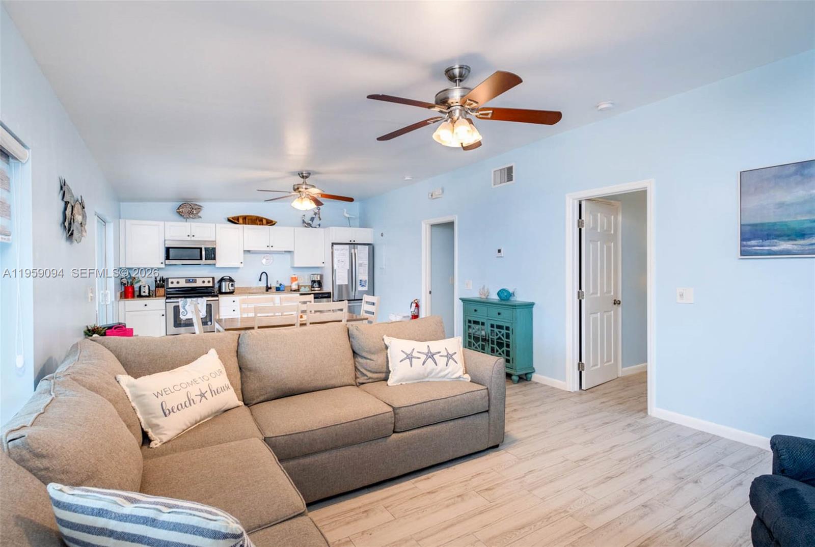 410 10th Street Key Colony Beach, FL 33051 - Photo 13 of 62 a living room with furniture and a wooden floor