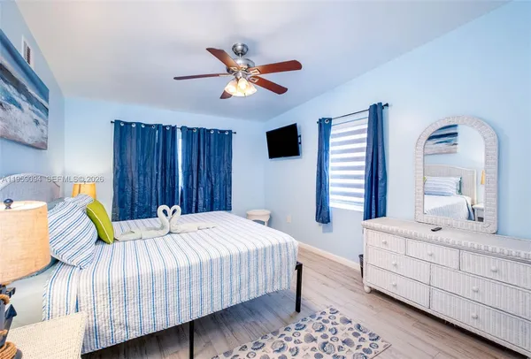a bedroom with a bed and a dresser