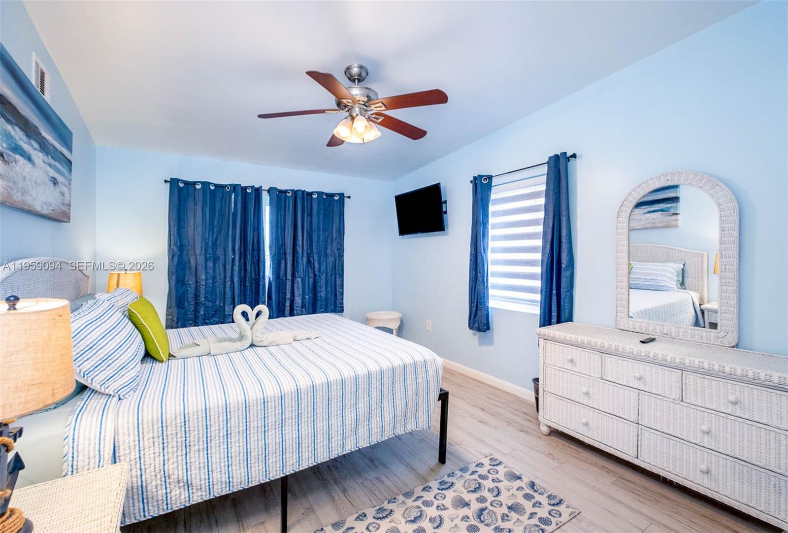 410 10th Street Key Colony Beach, FL 33051 - Photo 15 of 62 a bedroom with a bed and a dresser