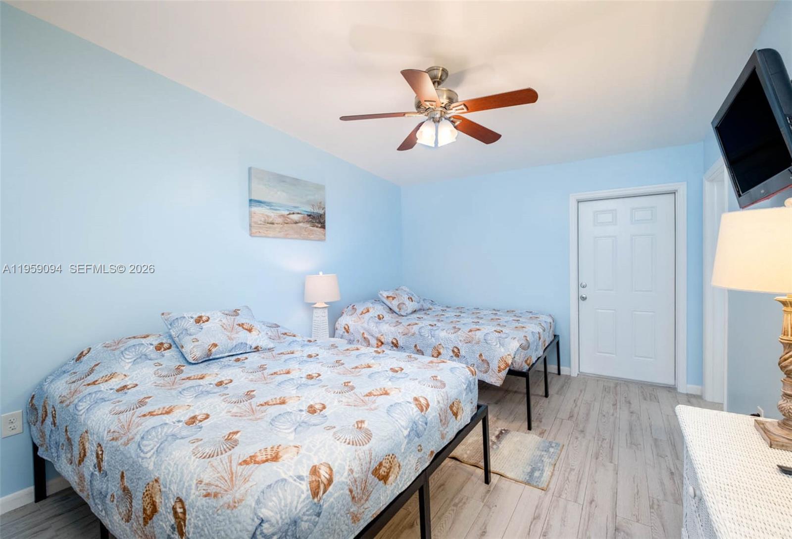 410 10th Street Key Colony Beach, FL 33051 - Photo 17 of 62 a bedroom with a bed and a flat screen tv