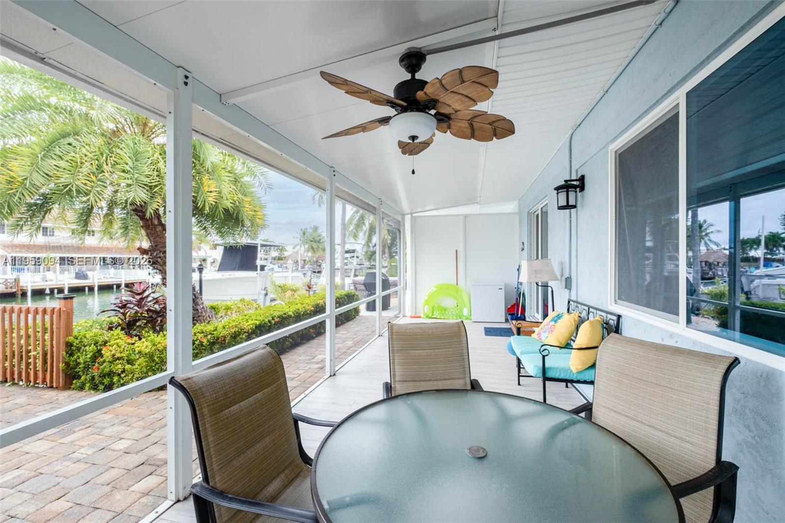 410 10th Street Key Colony Beach, FL 33051 - Photo 21 of 62 a living room with furniture and a large window