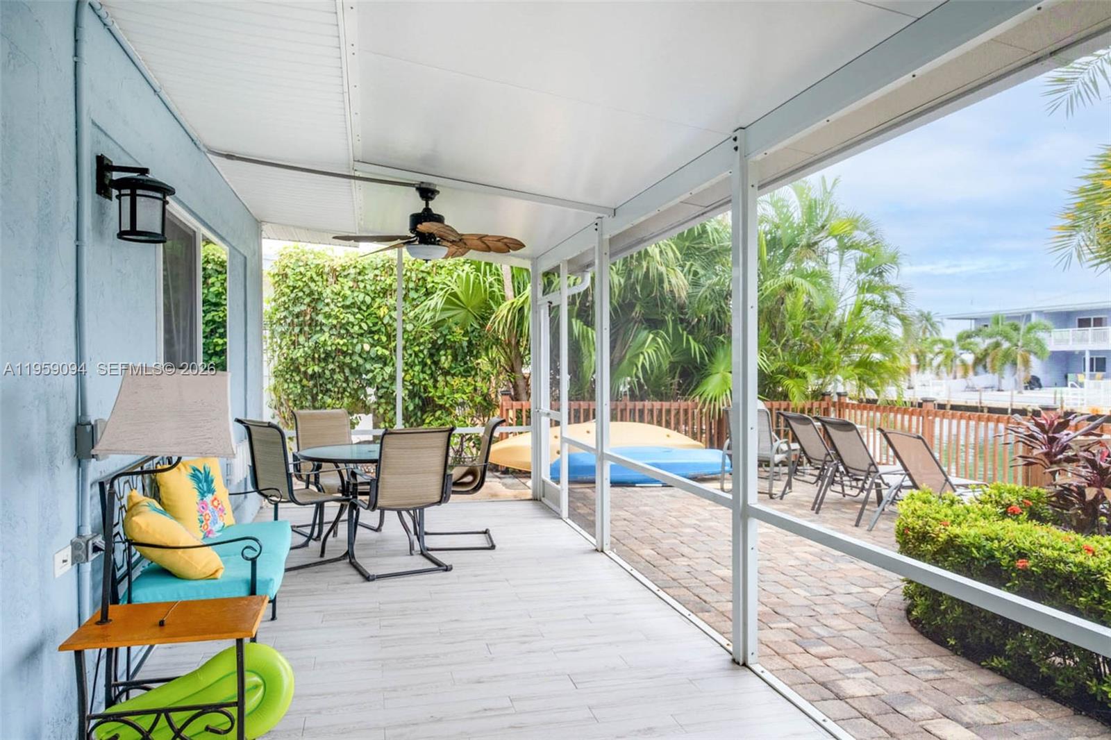 410 10th Street Key Colony Beach, FL 33051 - Photo 21 of 62 a living room filled with furniture and a garden