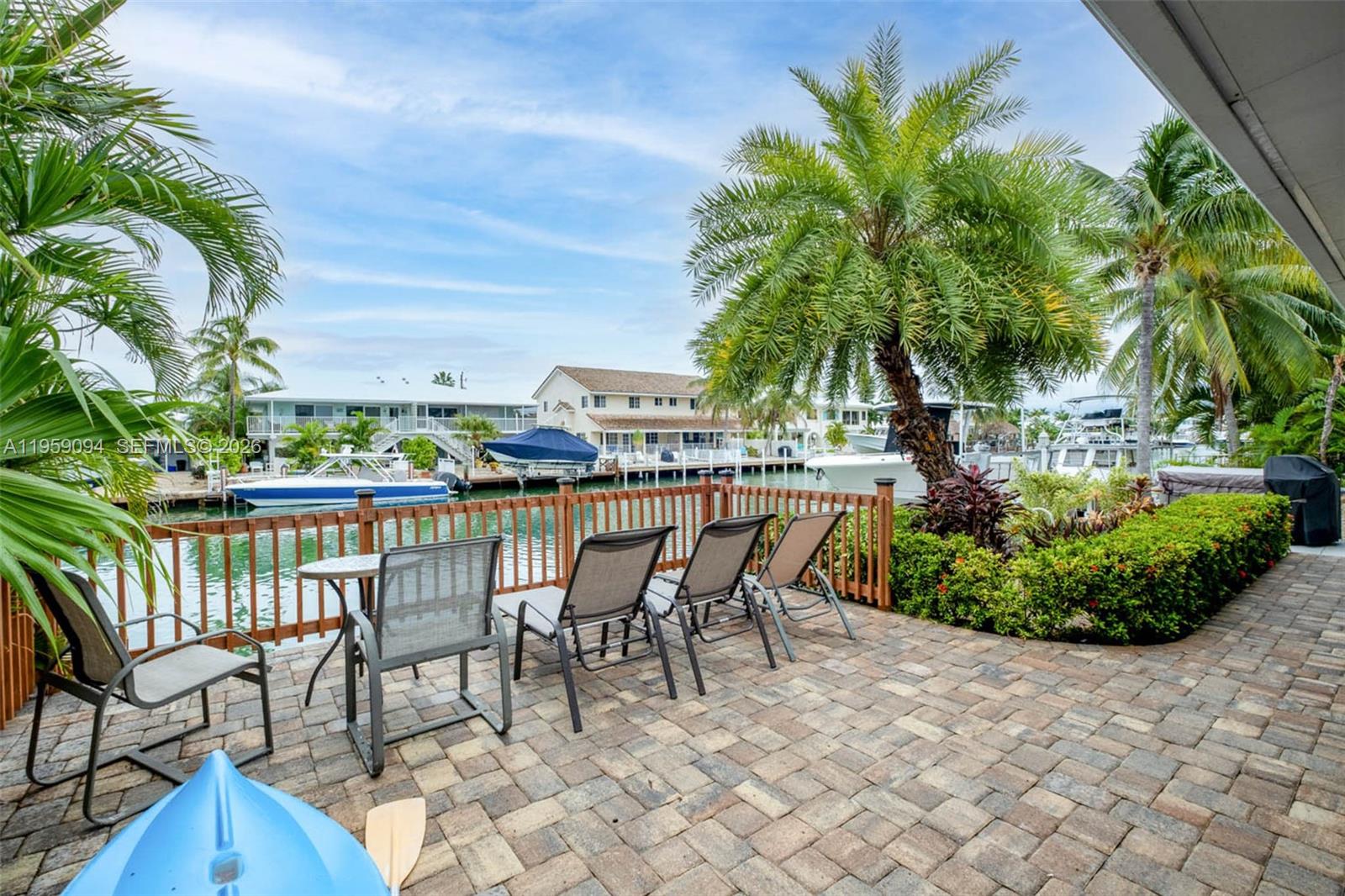 410 10th Street Key Colony Beach, FL 33051 - Photo 25 of 62 a view of a chairs and table in patio