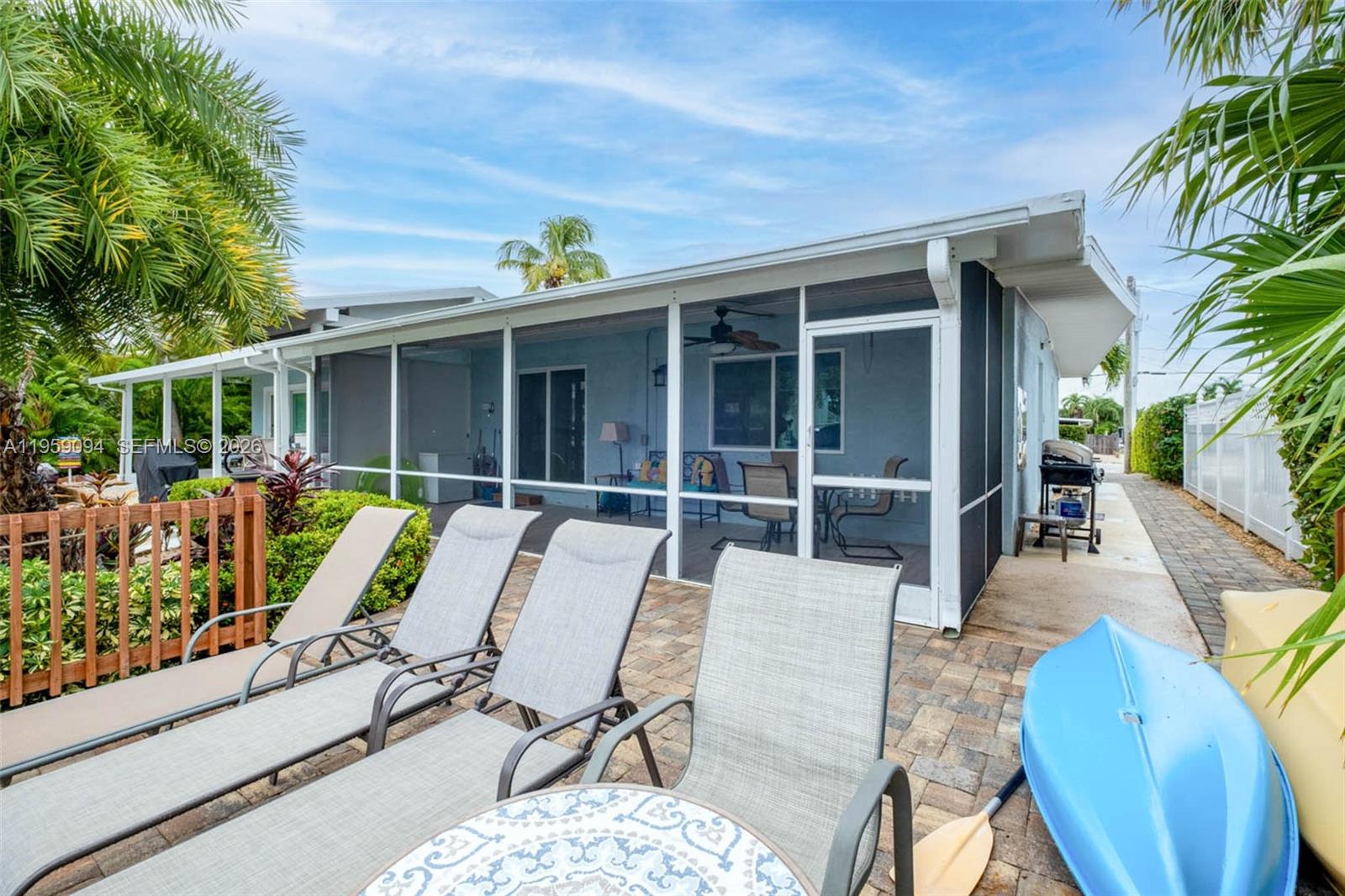 410 10th Street Key Colony Beach, FL 33051 - Photo 26 of 62 a view of a patio with table and chairs and potted plants