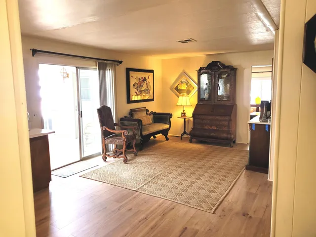 a kitchen with stainless steel appliances kitchen island granite countertop a refrigerator stove top oven and sink