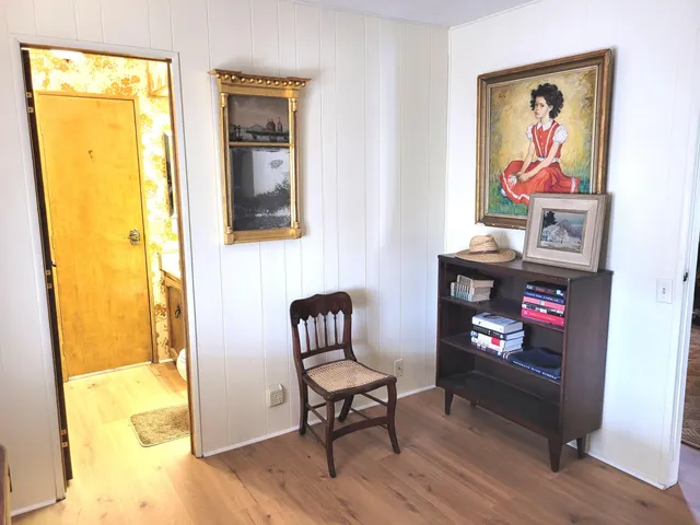 a view of room with wooden floor