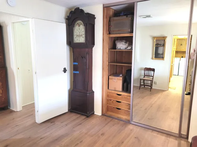 a view of a livingroom with furniture and workspace