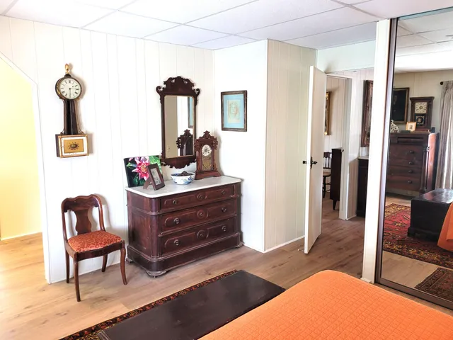 a view of living room with furniture and a window