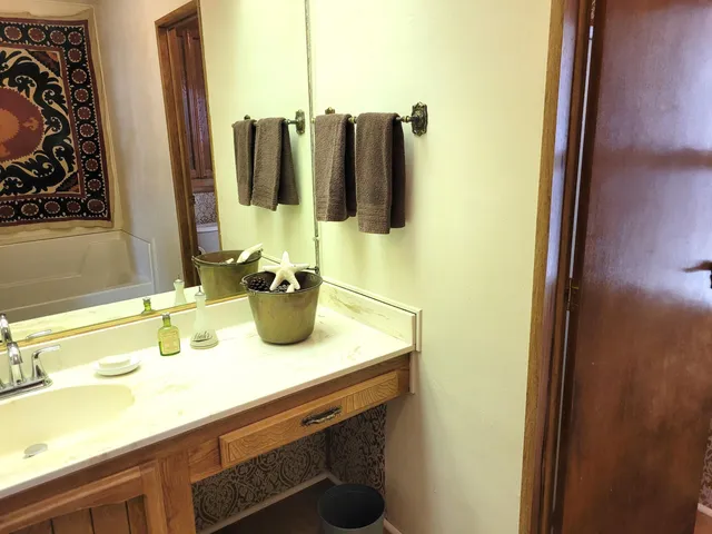 a bathroom with a bathtub and shower