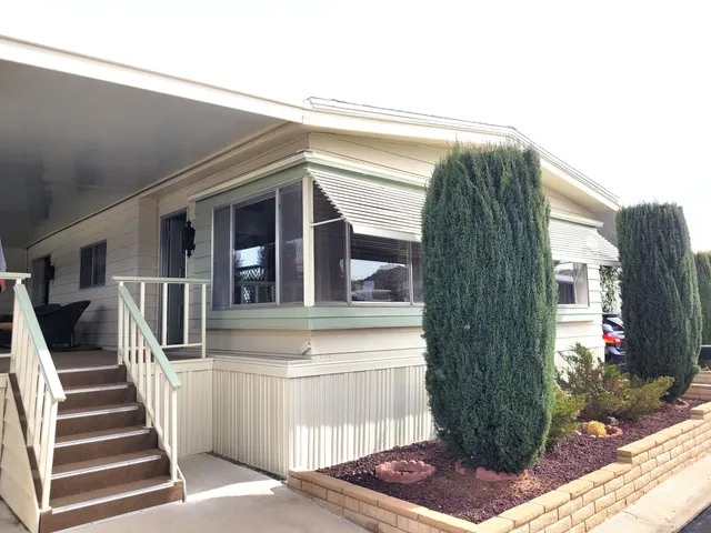 a view of a house with a door and a window