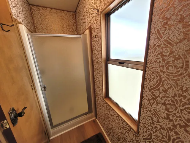 a bedroom with a bed and a walk in closet