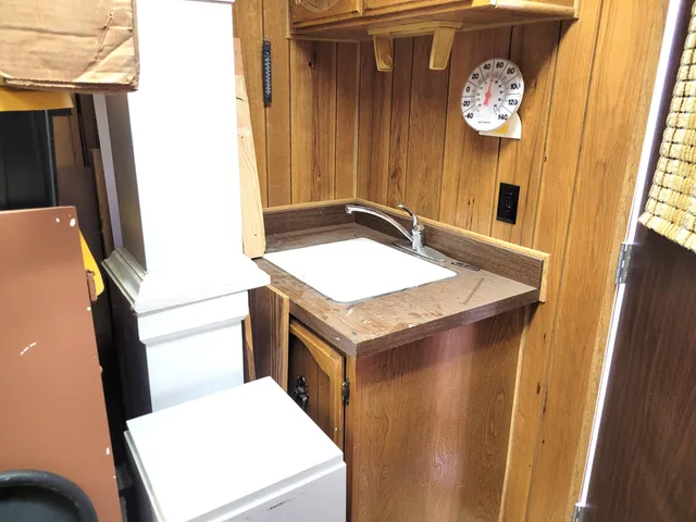 a view of a porch with wooden floor and stairs