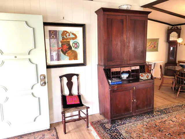 a living room with hard wood flooring