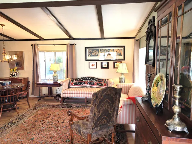 a bedroom with furniture and a window