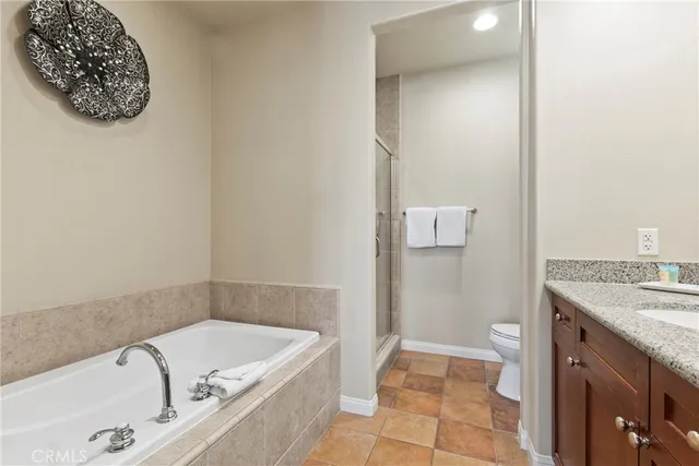 a bathroom with a tub sink and vanity