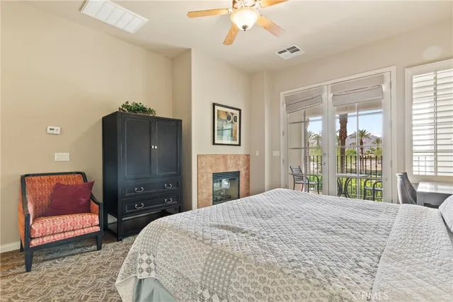 a bedroom with a bed and a couch