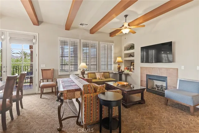 a living room with fireplace furniture and a flat screen tv