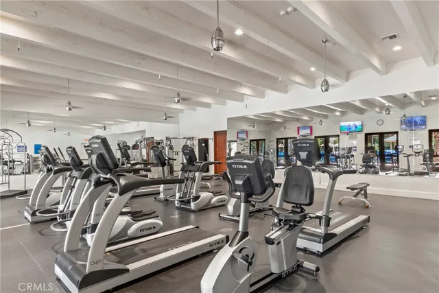 a swimming pool with outdoor seating and yard