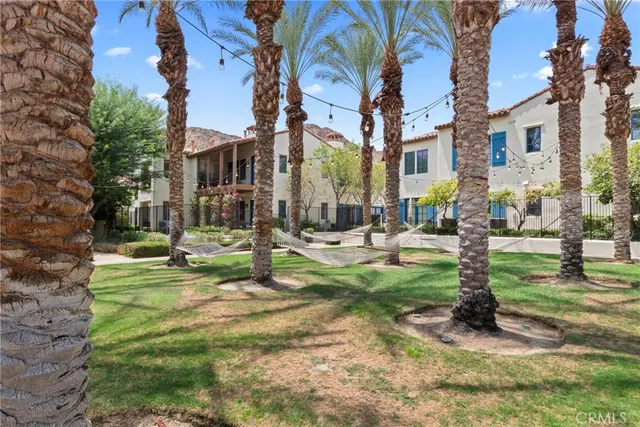 a swimming pool with outdoor seating and yard