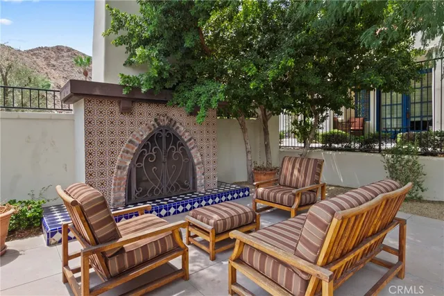 a view of a patio with a table and chairs