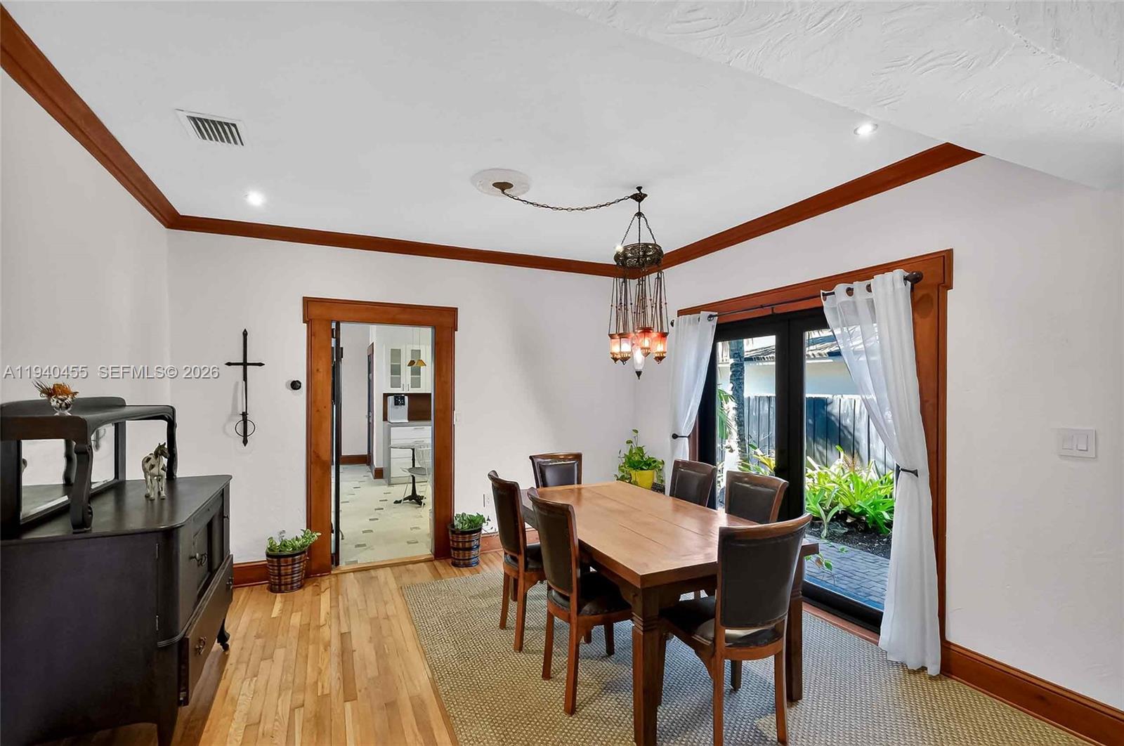452 Southwest 21st Road Miami, FL 33129 - Photo 9 of 51 a view of a dining room with furniture window and wooden floor