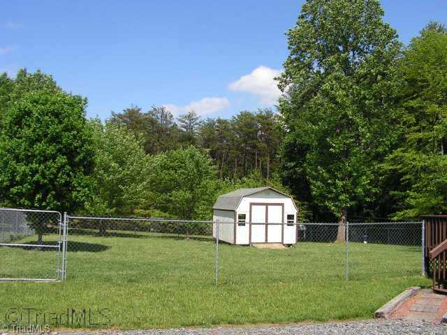 3645 Settle Bridge Road Stoneville, NC 27048 - Photo 6 of 6 Other. fenced back with storage building