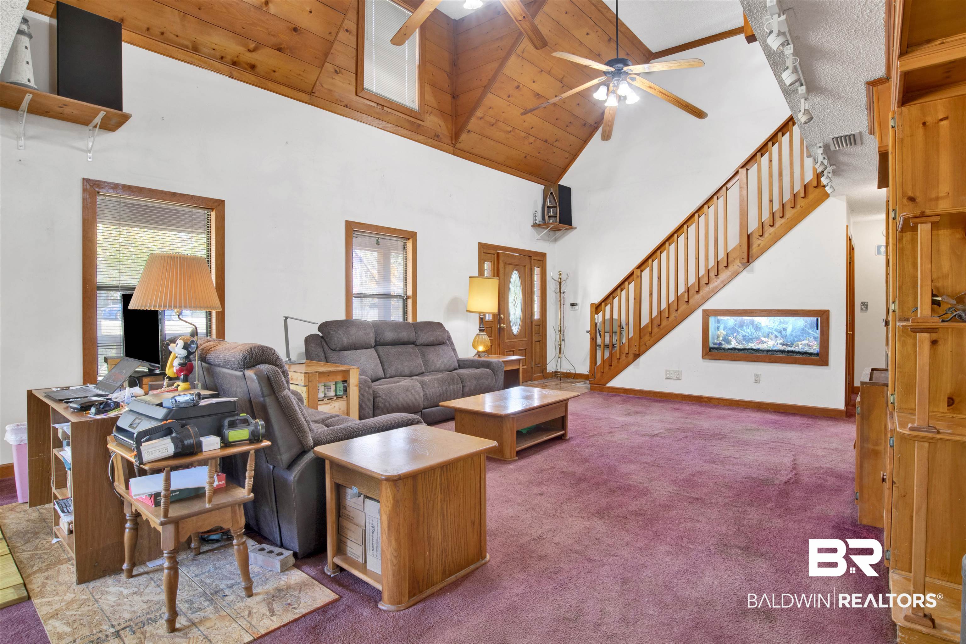 4890 Red Creek Road Semmes, AL 36575 - Photo 11 of 47 Carpeted living room featuring track lighting, high vaulted ceiling, wooden ceiling, and ceiling fan