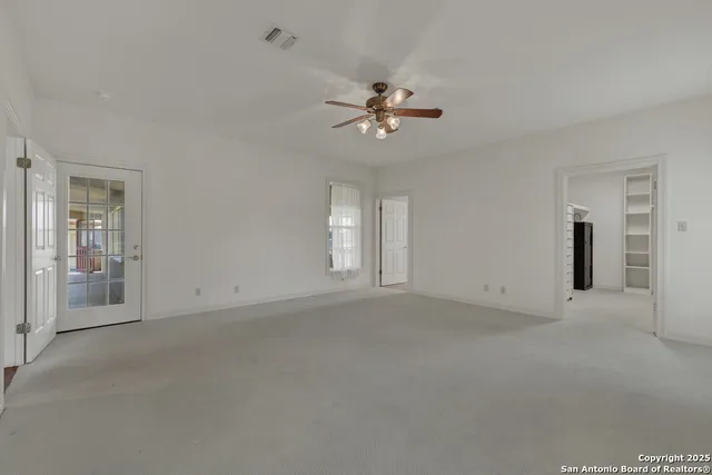 a view of empty room with fan