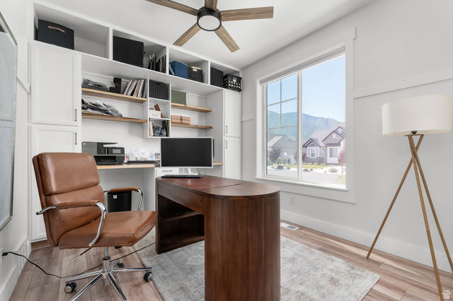500 North 516th Street West, Unit 19 Mapleton, UT 84664 - Photo 13 of 41 Bright office space featuring a large window, built-in shelving, wood-finish flooring, and ceiling fan