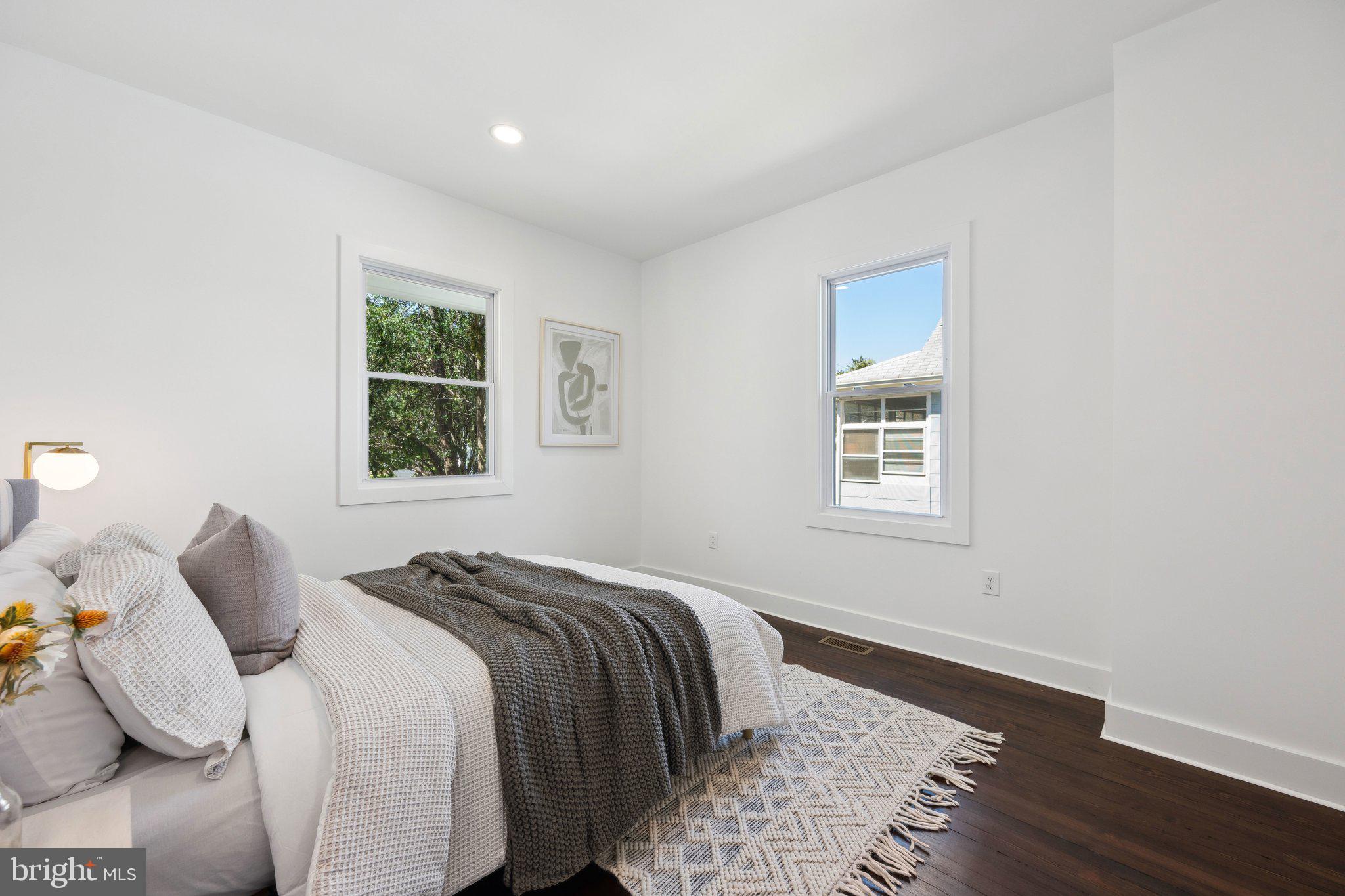 4007 35th Street Mount Rainier, MD 20712 - Photo 14 of 49 a bed sitting in a bedroom next to a window