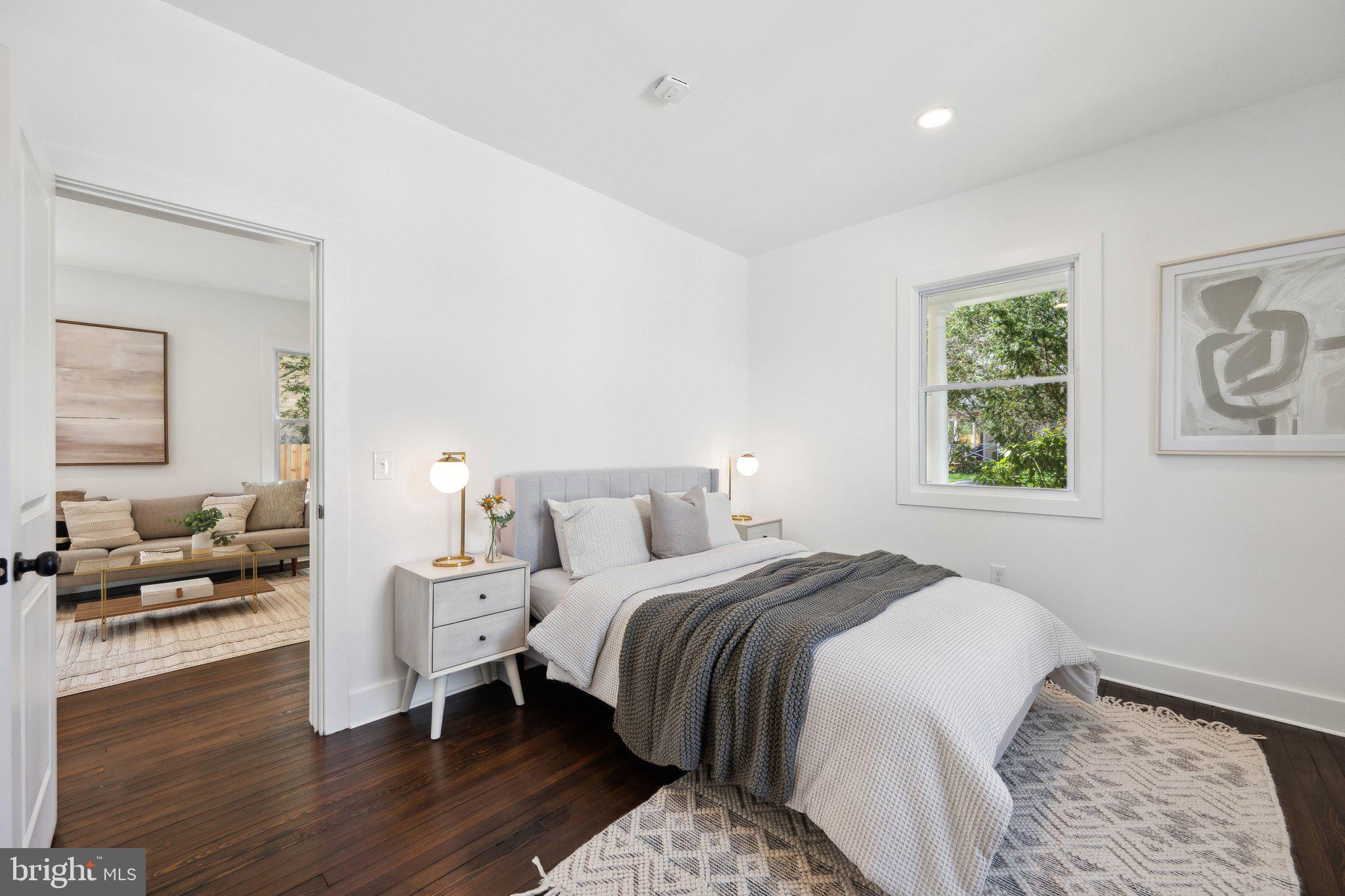 4007 35th Street Mount Rainier, MD 20712 - Photo 15 of 49 a bedroom with a bed and wooden floor