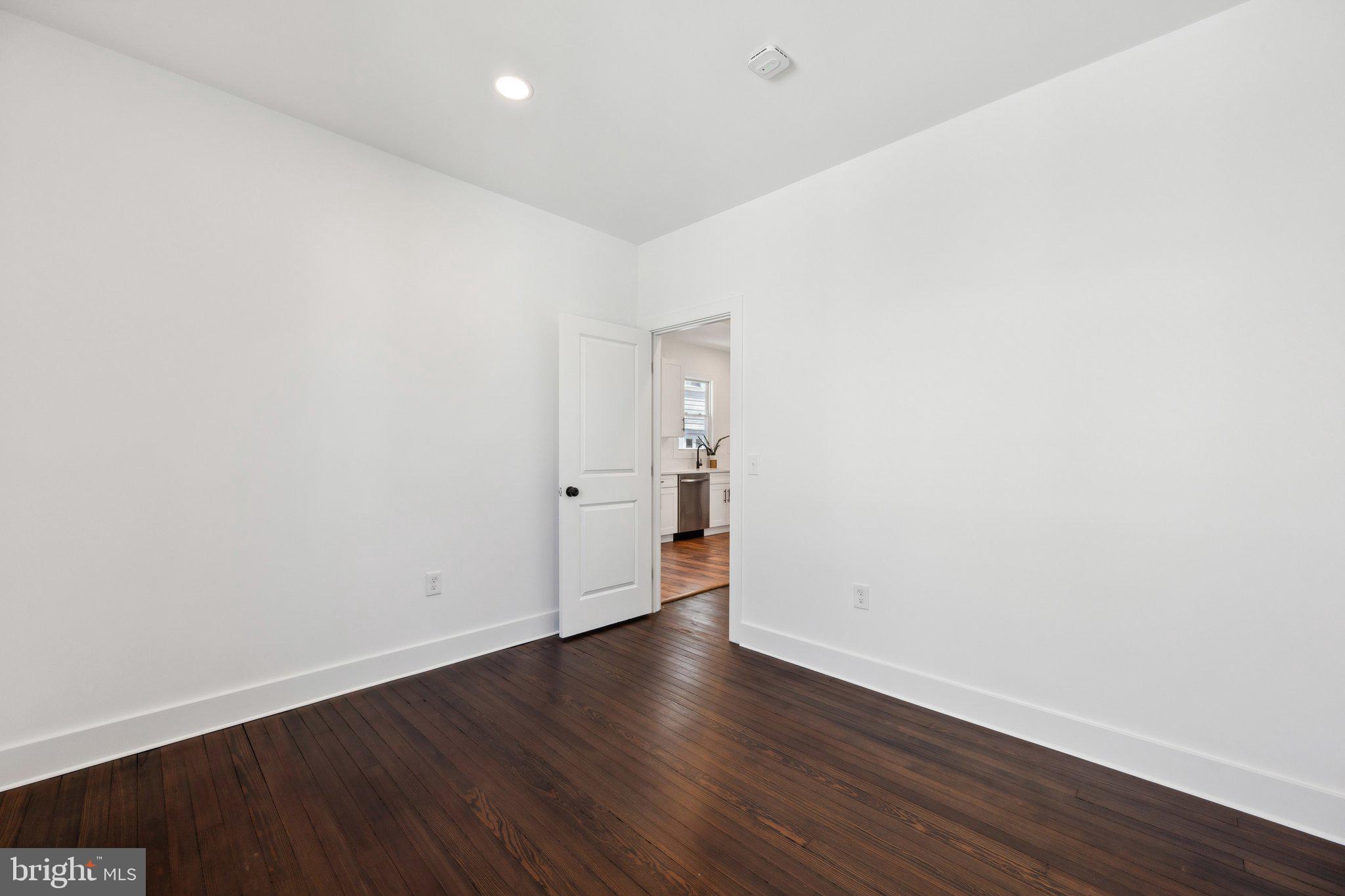 4007 35th Street Mount Rainier, MD 20712 - Photo 17 of 49 a view of an empty room with wooden floor