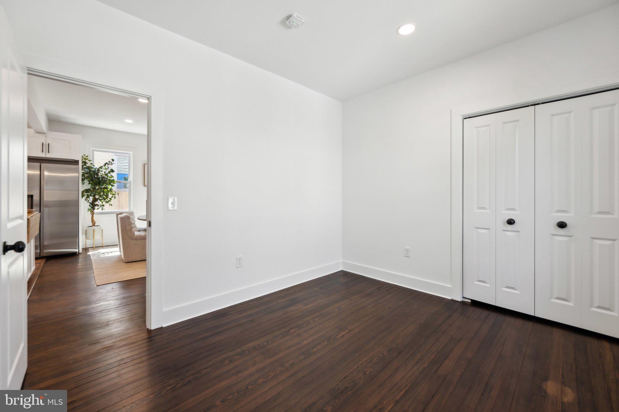 4007 35th Street Mount Rainier, MD 20712 - Photo 18 of 49 a view of a hallway with wooden floor