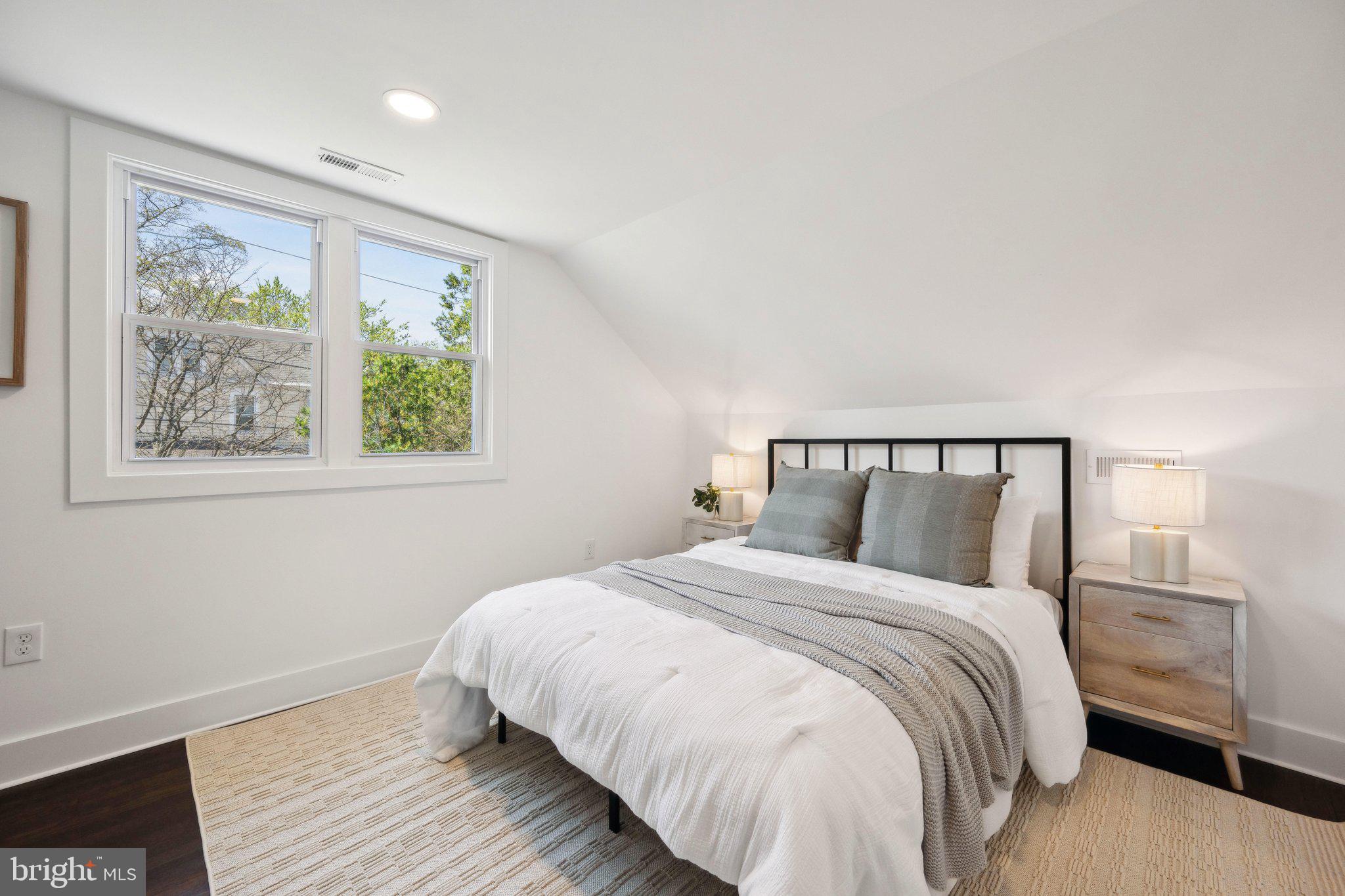 4007 35th Street Mount Rainier, MD 20712 - Photo 19 of 49 a bedroom with a large bed and a window