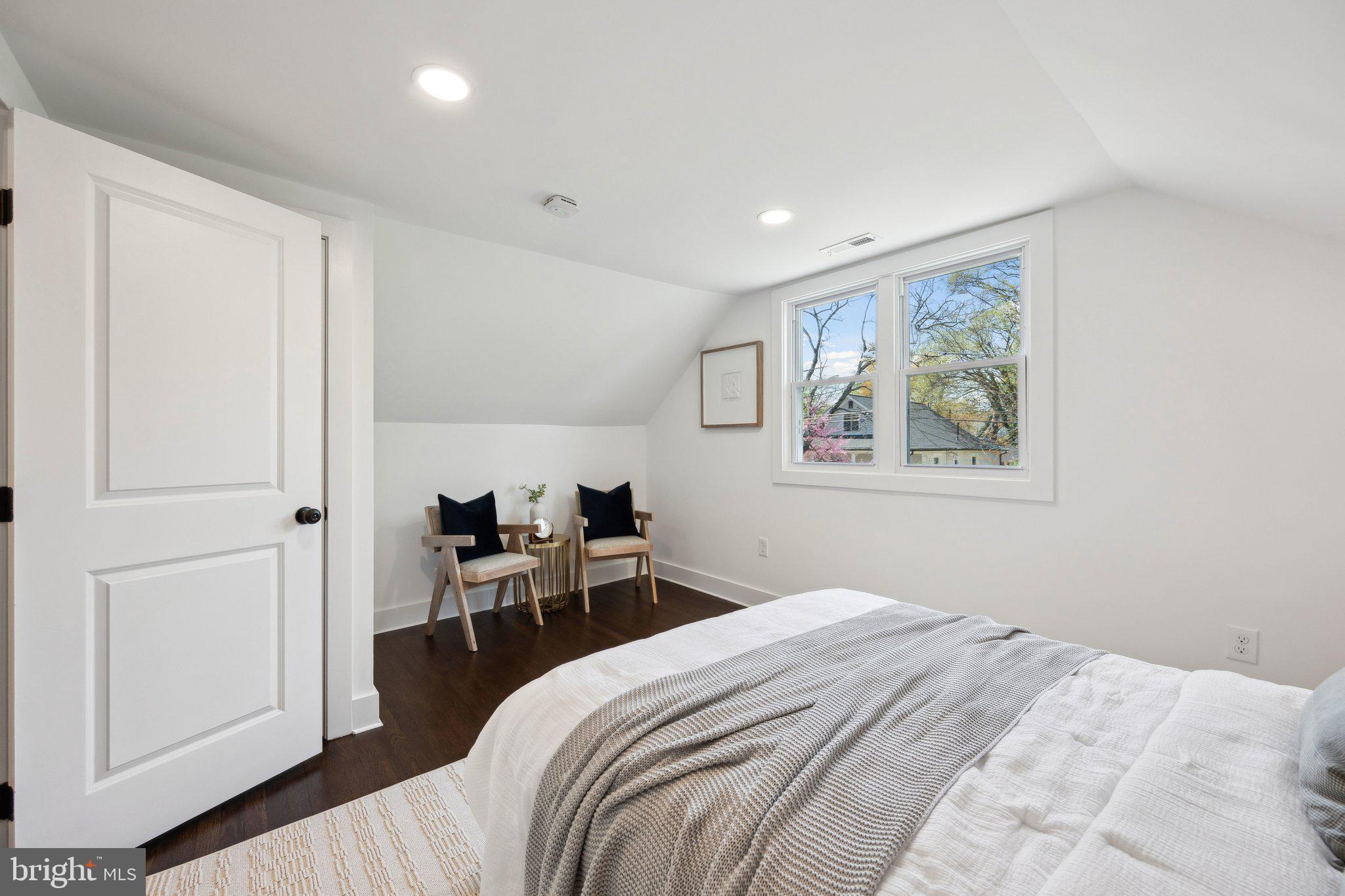 4007 35th Street Mount Rainier, MD 20712 - Photo 21 of 49 a bedroom with a bed and a painting on the wall