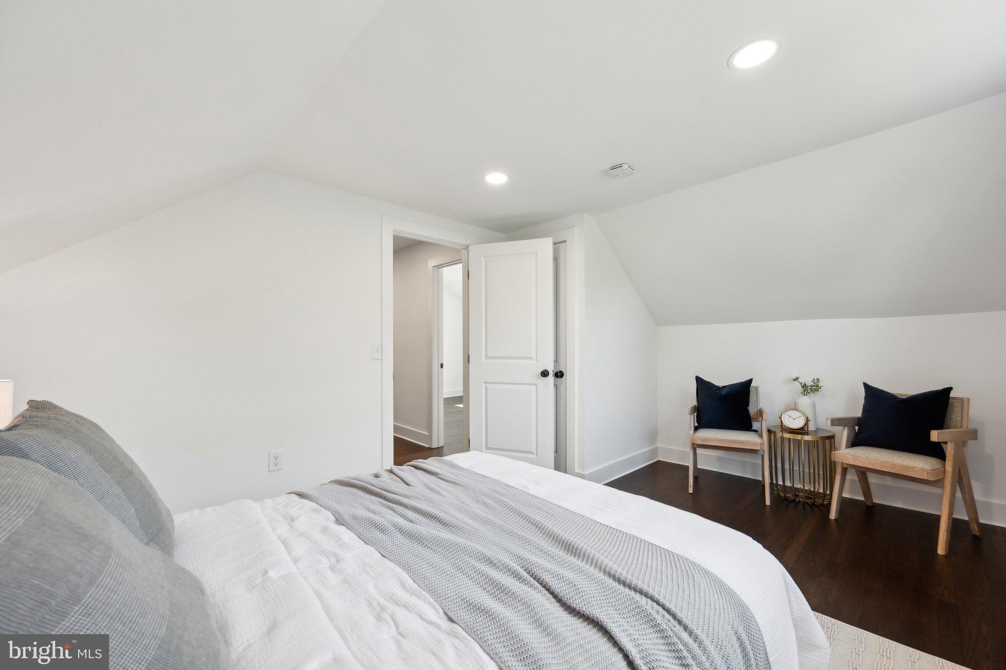 4007 35th Street Mount Rainier, MD 20712 - Photo 22 of 49 a bedroom with a bed and chair