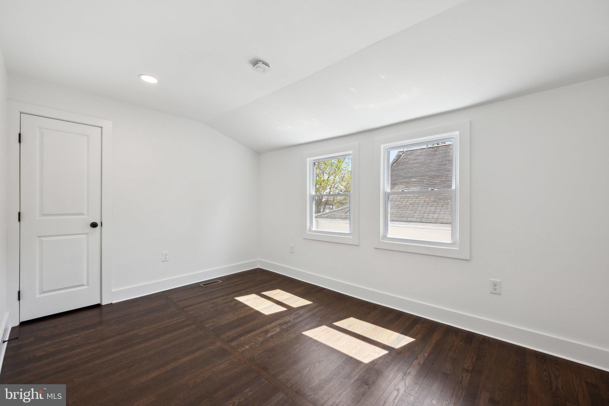 4007 35th Street Mount Rainier, MD 20712 - Photo 23 of 49 an empty room with wooden floor and windows