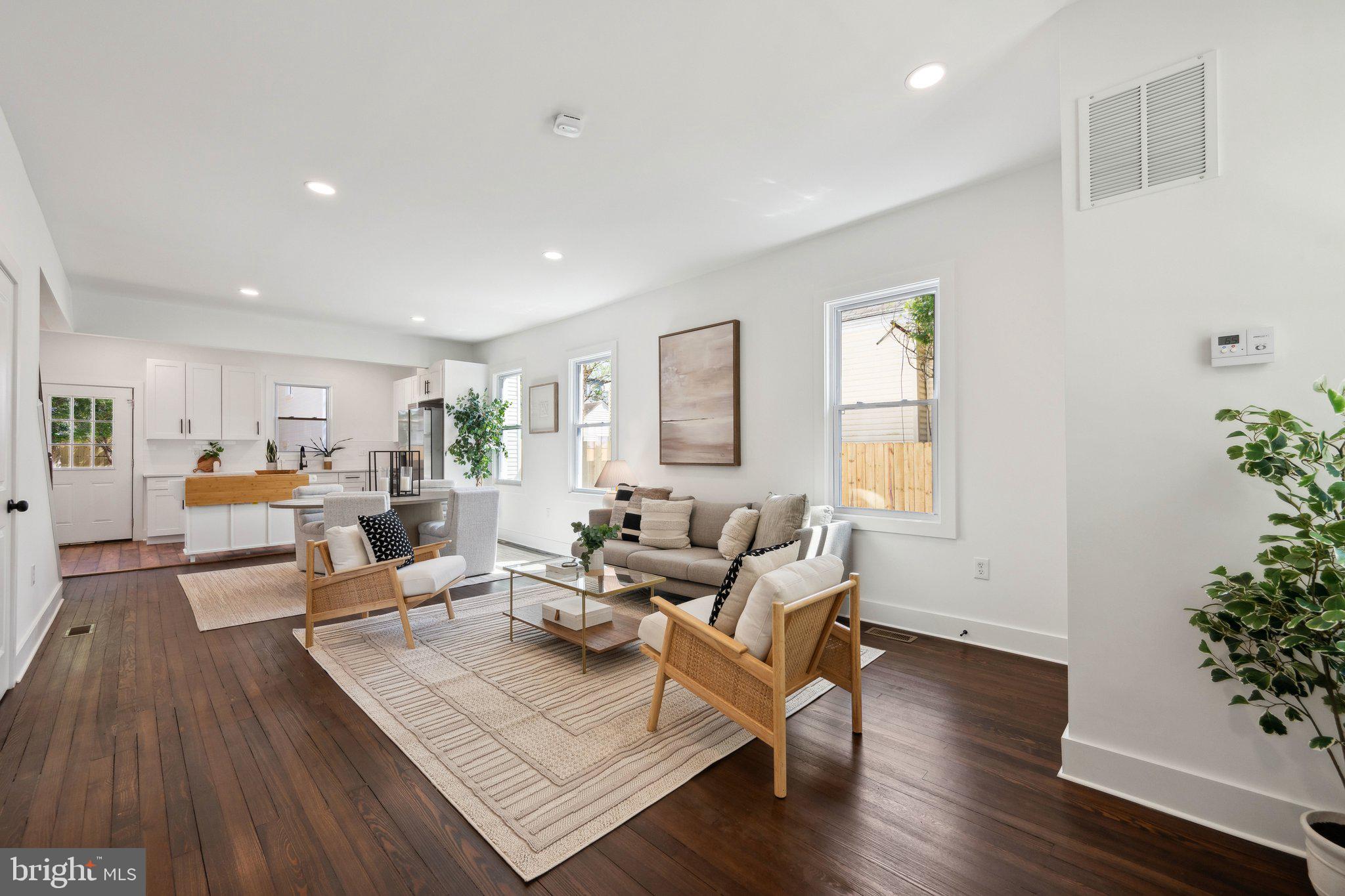 4007 35th Street Mount Rainier, MD 20712 - Photo 3 of 49 a living room with furniture and a potted plant
