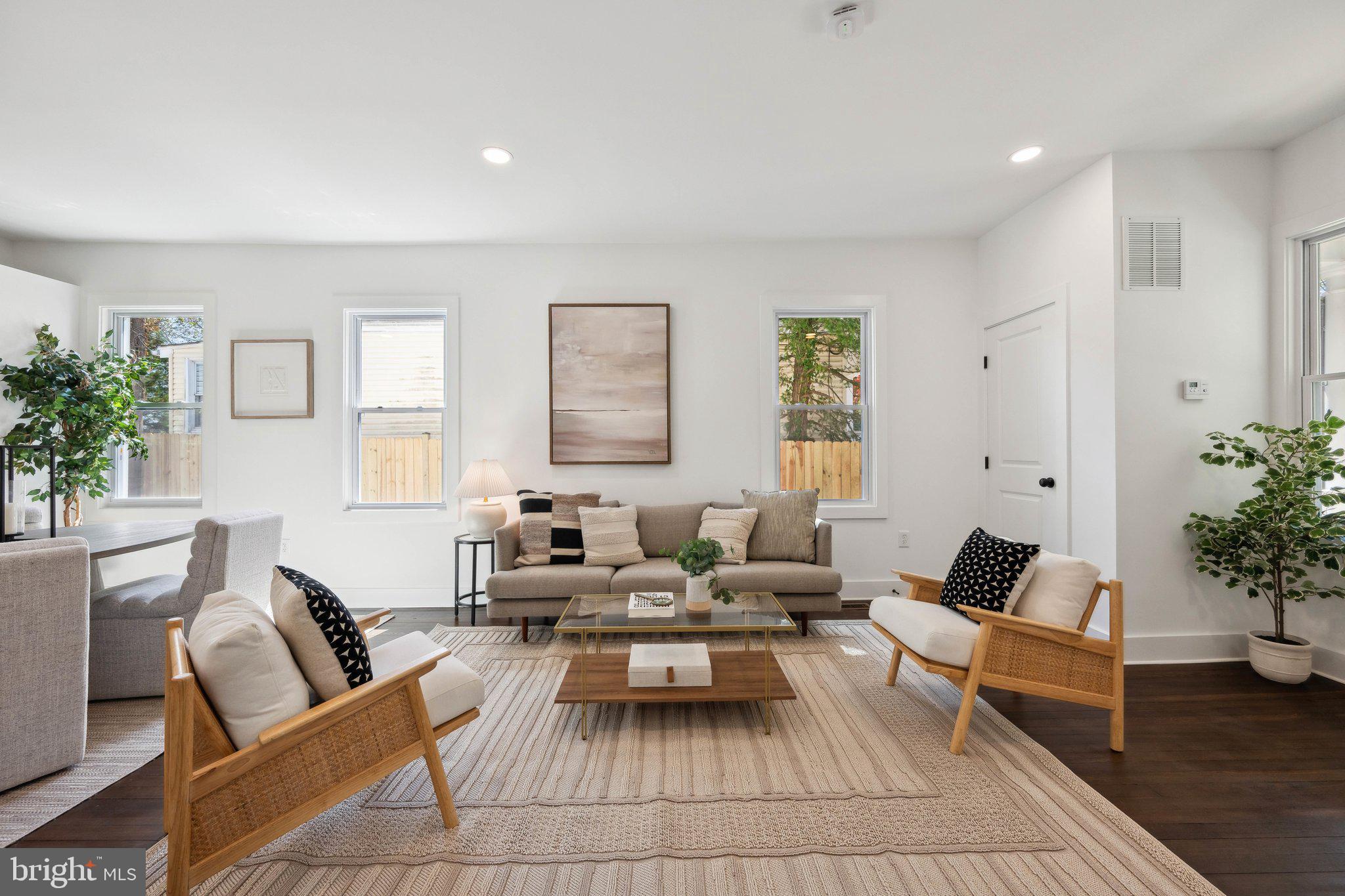 4007 35th Street Mount Rainier, MD 20712 - Photo 5 of 49 a living room with furniture and a potted plant