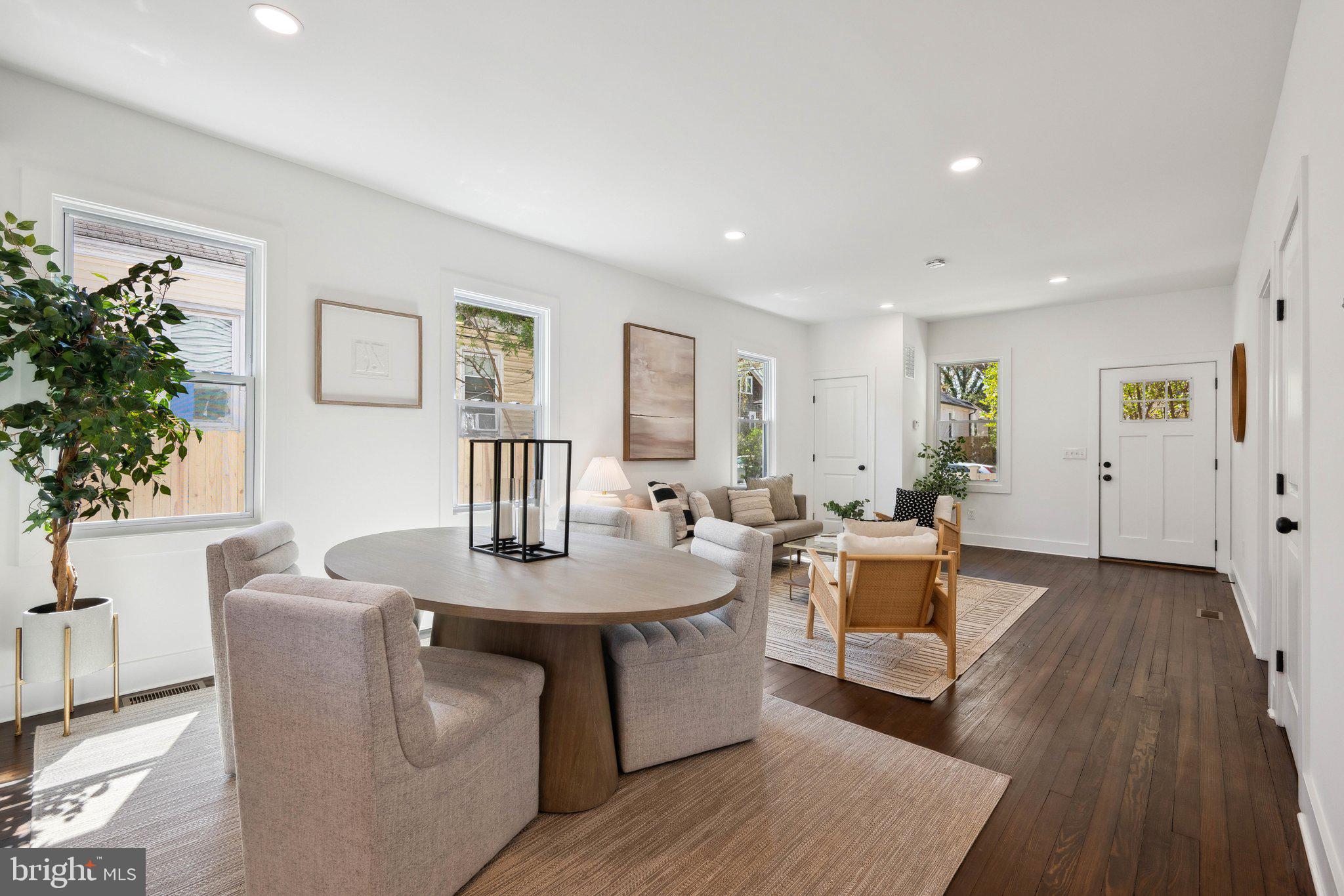 4007 35th Street Mount Rainier, MD 20712 - Photo 7 of 49 a living room with furniture a potted plant and kitchen view