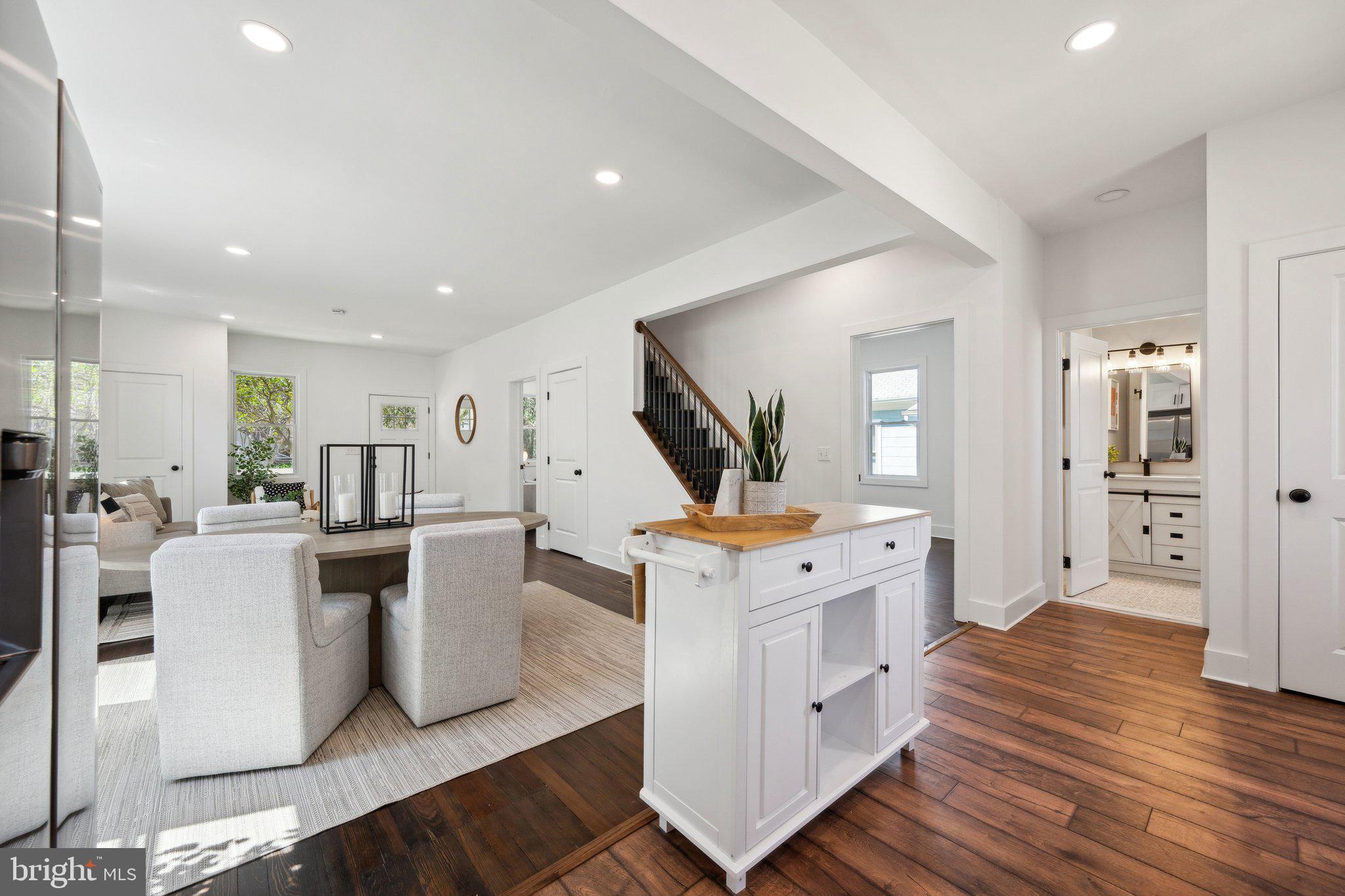 4007 35th Street Mount Rainier, MD 20712 - Photo 10 of 49 a open kitchen with white cabinets and stainless steel appliances