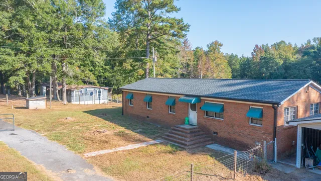 a aerial view of a house with a yard