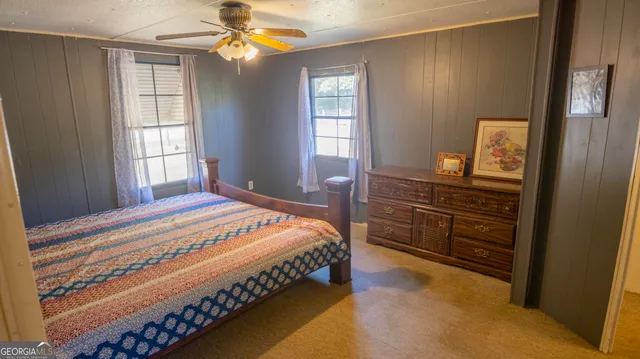 a bedroom with furniture and a chandelier