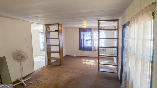 a kitchen with a refrigerator and a sink