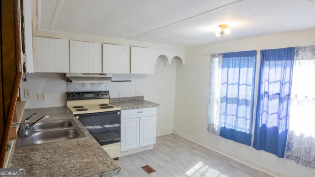 a view of an empty room and a window