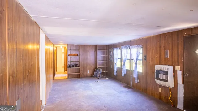 a view of empty room with windows