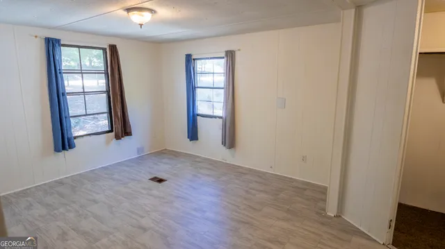 a view of a bathroom with wooden floor