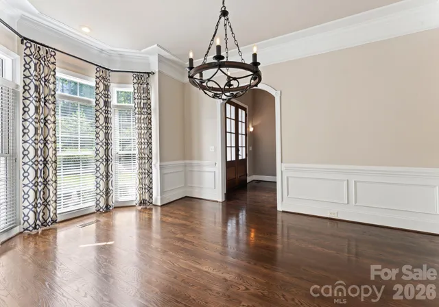 a kitchen with a sink a counter top space and cabinets
