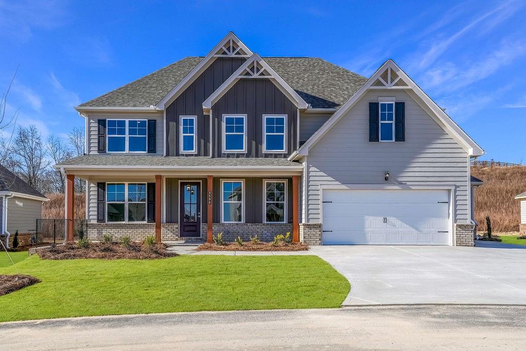 2596 Parkside Way Gainesville, GA 30507 - Photo 1 of 33 a front view of a house with a yard